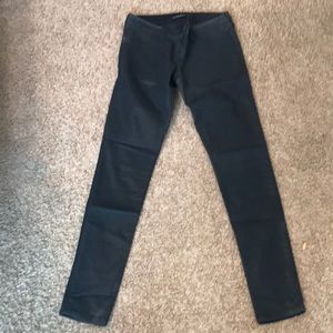 Black faux leather skinny jeans
